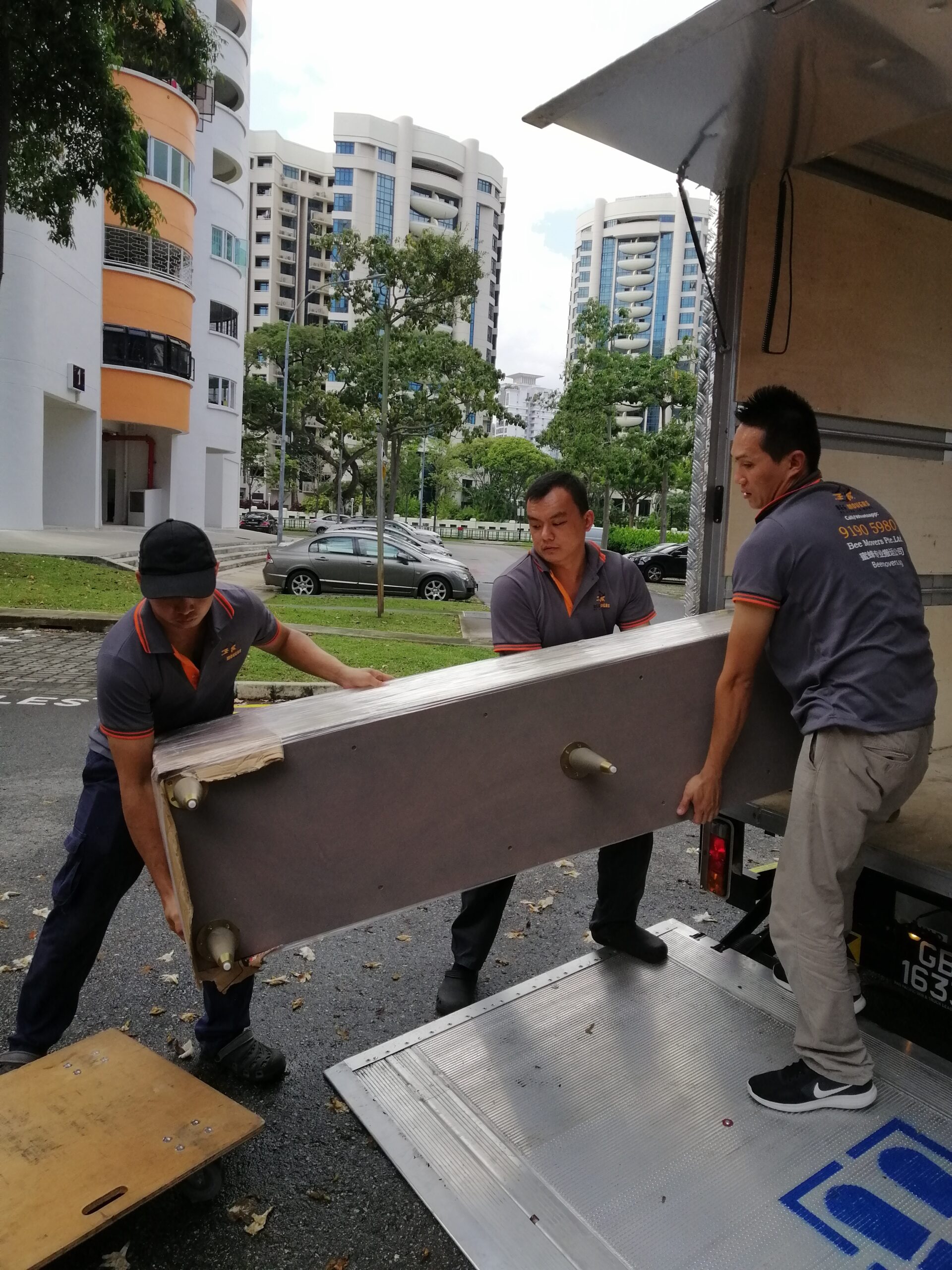Bee Movers team handling a residential house move in Singapore with professional care